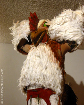 Subservient Chicken crosses the road if you tell her to!