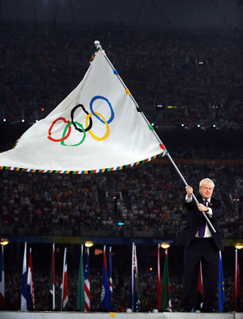 Boris Johnson waves the Olympic flag or IS it Boris Johnson???