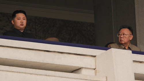 Kim Jong Il looking at Kim Jong Un